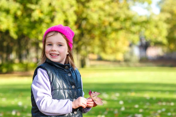 Girl with a pink hat on — Stock Photo, Image