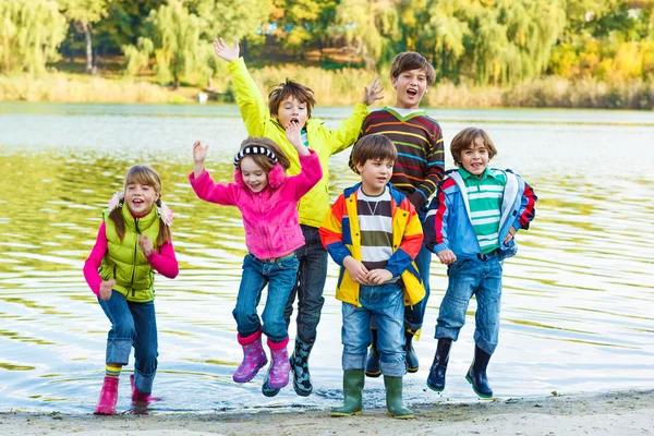 Kids in rubber boots — Stock Photo, Image