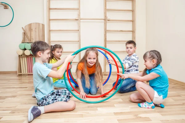 Kids with hula hoops — Stock Photo, Image