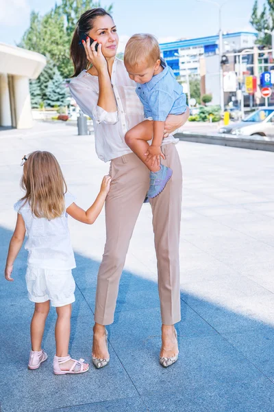 Young woman with two children — Stock Photo, Image