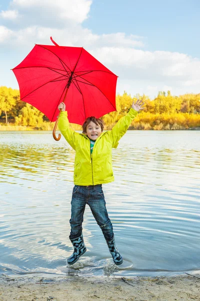 Boy in rubber boots — Stock Photo, Image