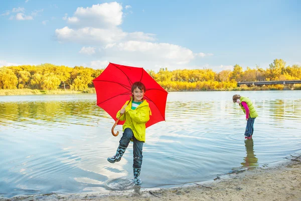 Boy in rubber boots — Stock Photo, Image