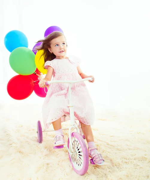 Girl on a bike — Stock Photo, Image