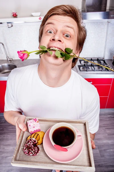 Man with flower in mouth — Stock Photo, Image