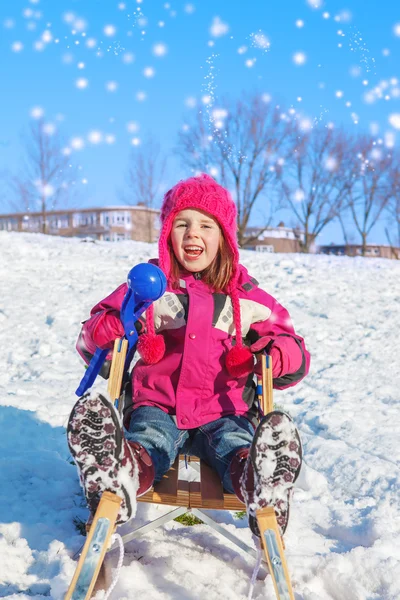 Girl with a snowball maker — Stock Photo, Image