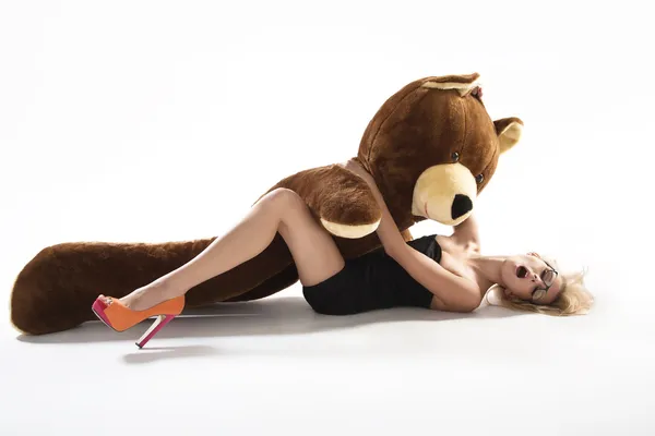 Sexy blonde with huge teddybear — Stock Photo, Image