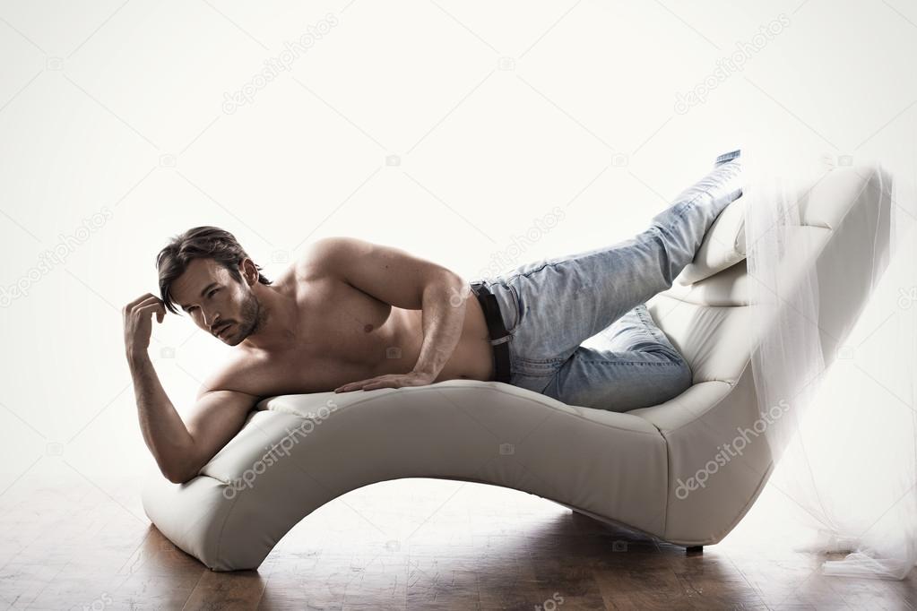 Young muscular man in a sexy pose