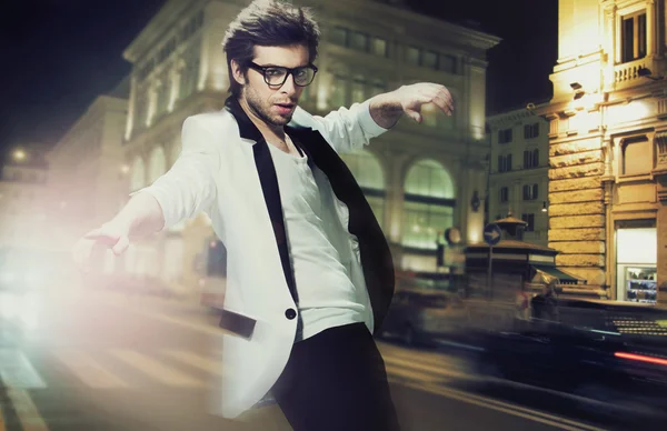 Young fashionable man on the street at night — Stock Photo, Image