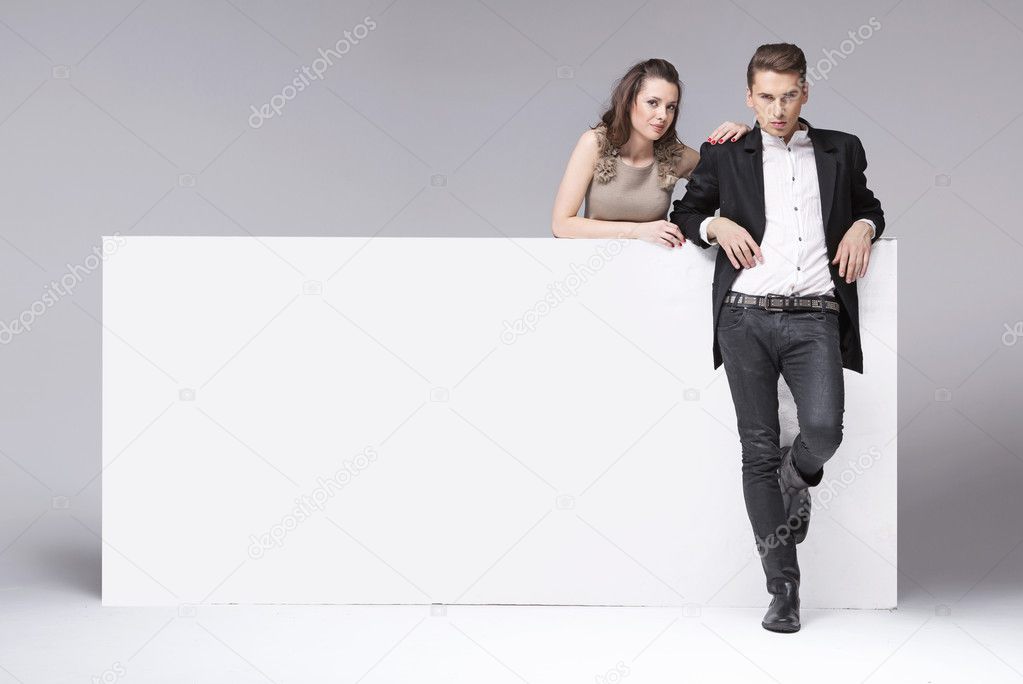 Fantastic young couple relaxing in the studio