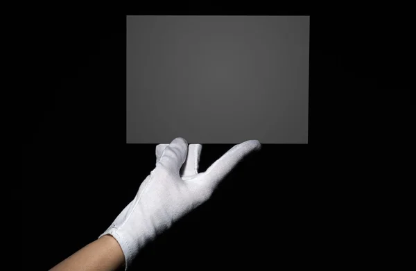 Female hand holding grey board — Stock Photo, Image