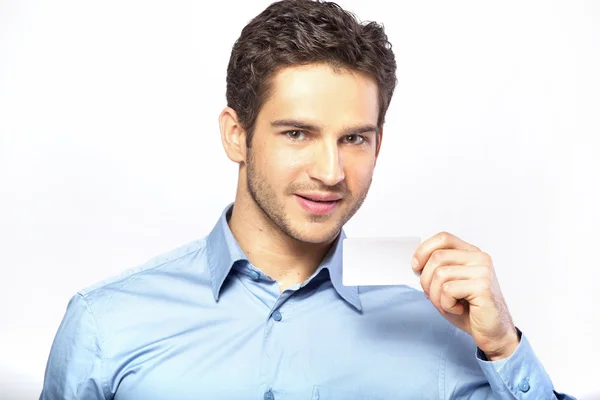 Good-looking man holding business card — Stock Photo, Image