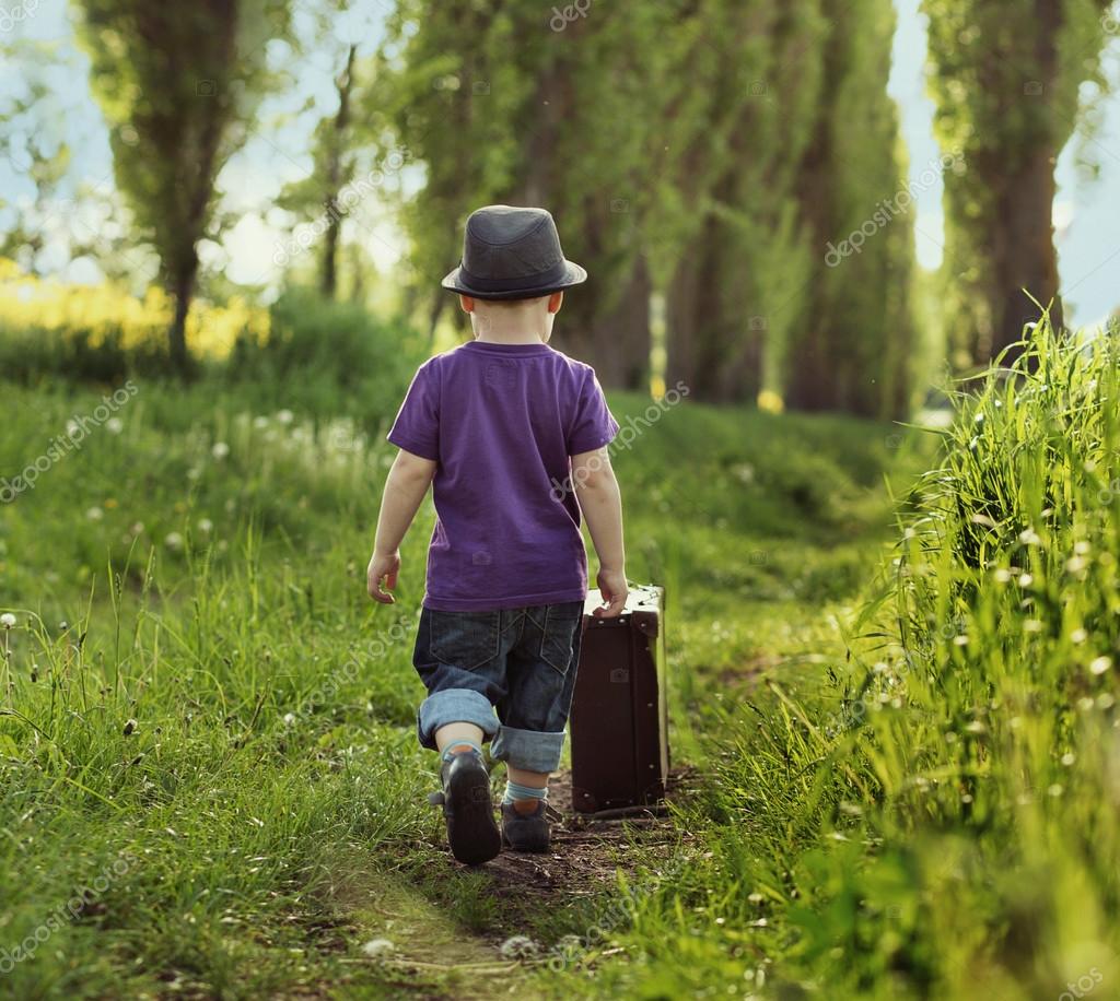 Little child carrying a suitcase Stock Photo by ©konradbak 27318771
