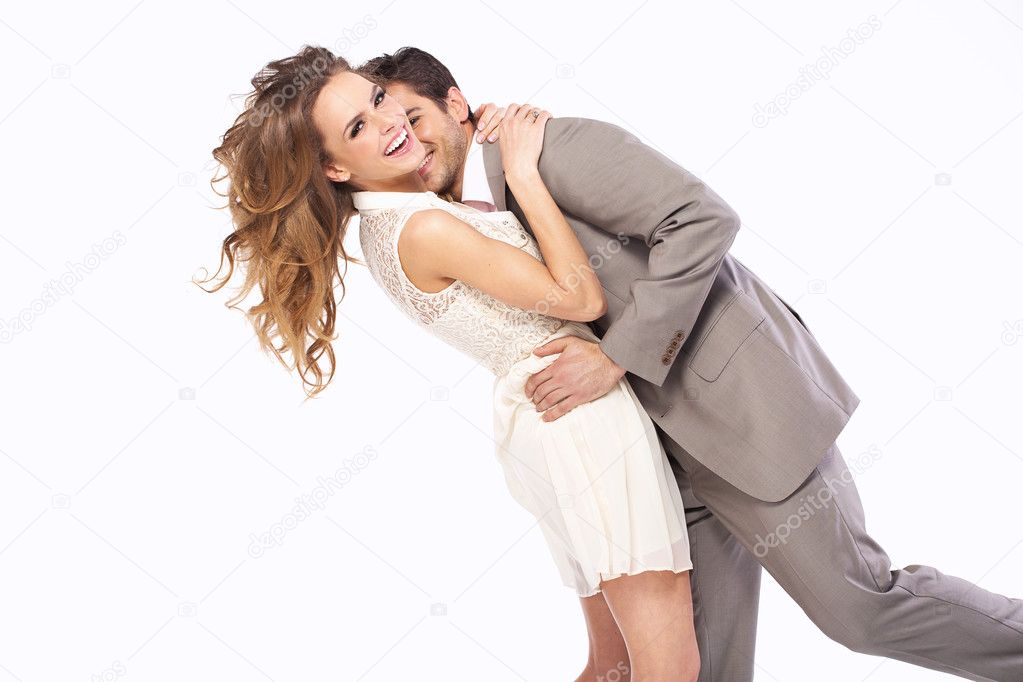 Delighted couple hugging each other