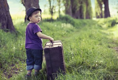 Little man leaving home with huge luggage clipart
