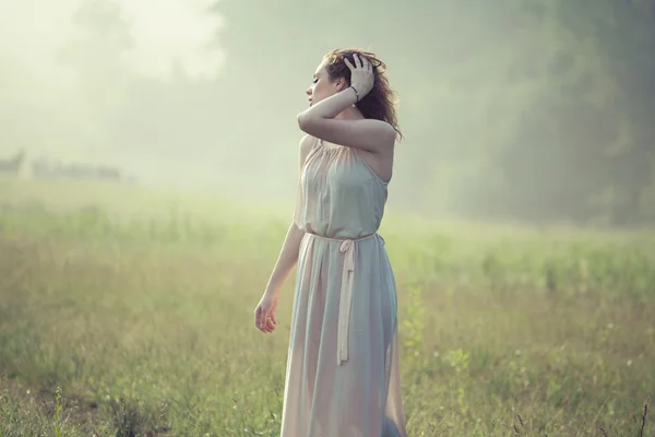 Whithe angel relaxing on the meadow — Stock Photo, Image