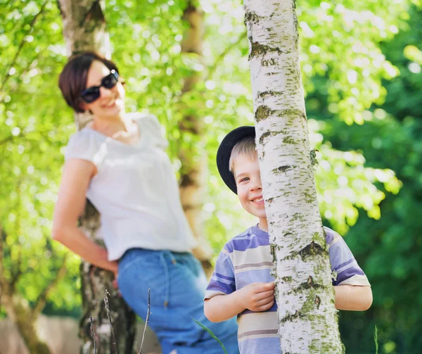Smiling mother looking after her son — Stock Photo, Image
