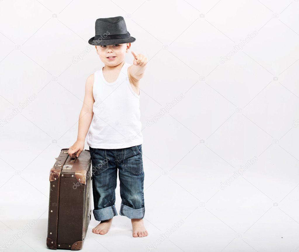 Little gentleman with huge suitcase