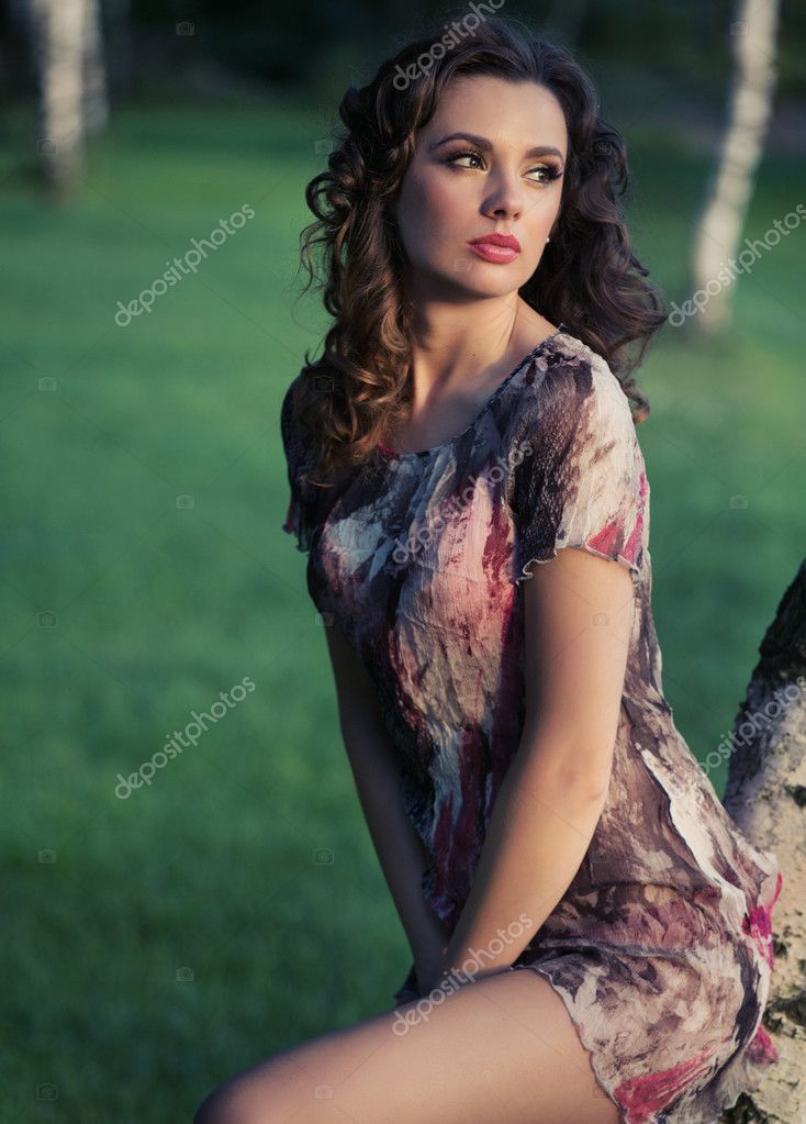 Delicate brunette woman looking at the landscape — Stock Photo ...