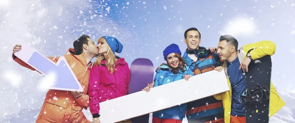 Laughing group of snowboarders with the snowing background — Stock Photo, Image