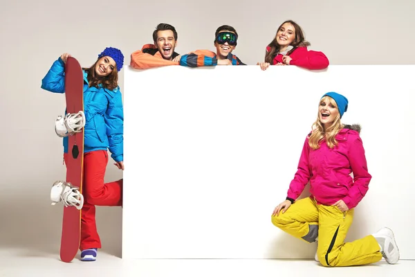 Lauhging people with the winter equipment — Stock Photo, Image
