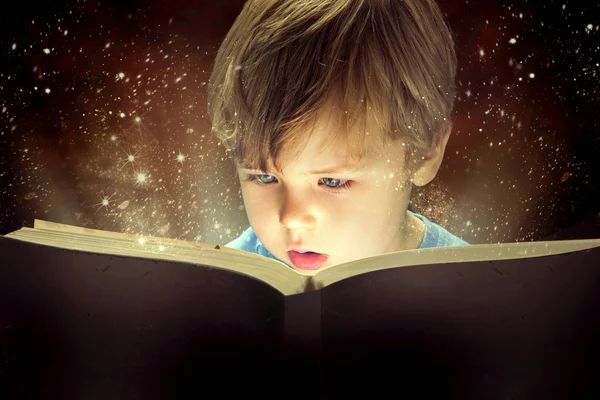 Little boy and the magic book — Stock Photo, Image