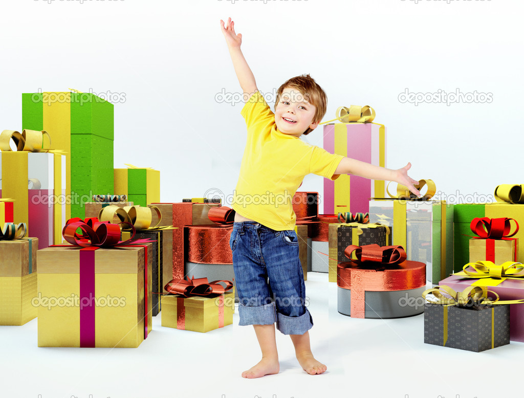 Cheerful kid with lots of presents