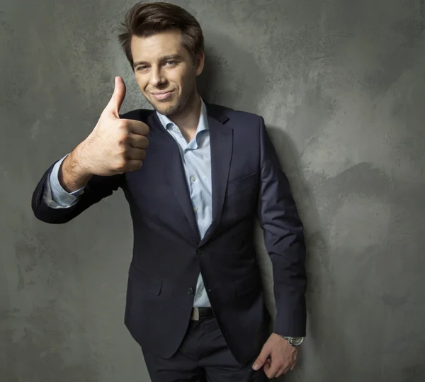 Man in suit showing the OK gesture — Stock Photo, Image