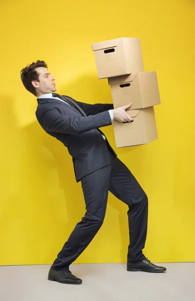 Handsome manager carrying the paper boxes — Stock Photo, Image