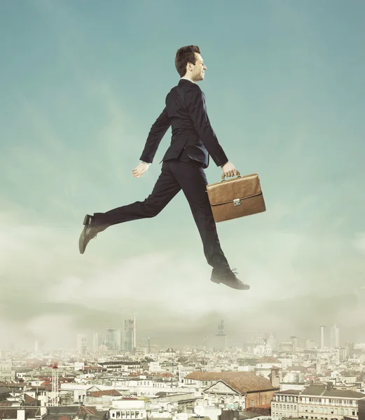 Conceptual photo of flying businessman — Stock Photo, Image