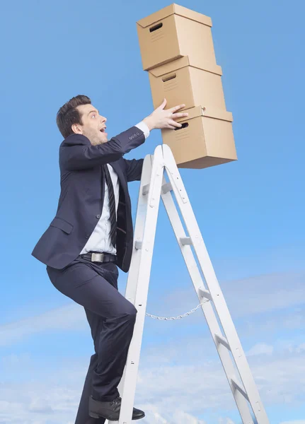 Young manager loosing the boxes — Stock Photo, Image