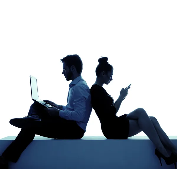 Young couple addicted to the internet — Stock Photo, Image
