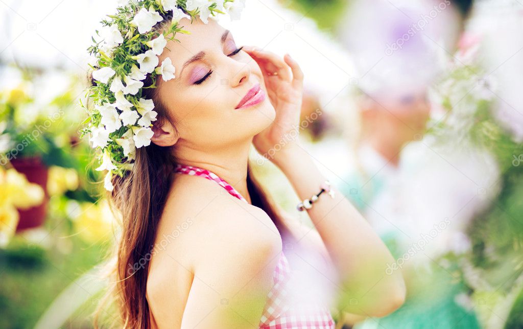 Pretty brunette lady with the colorful wreath on the head
