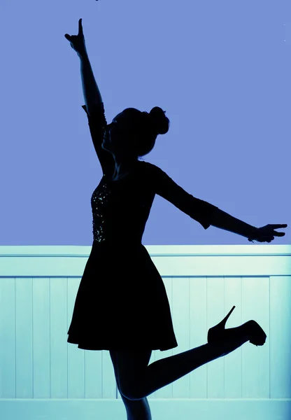 Silhouette of the young dancing woman — Stock Photo, Image