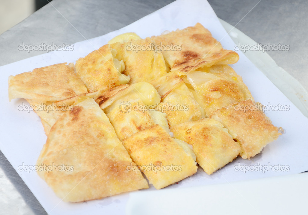 Dessert style of fried Roti with banana in Thailand