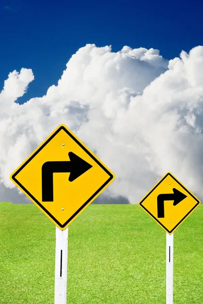 Turn right sign with cloudy sky and nice meadows — Stock Photo, Image