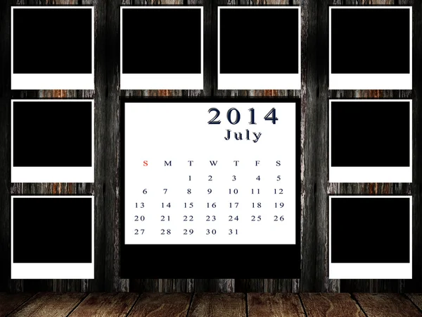 Calendário 2014 conjunto com moldura de foto na parede grunge — Fotografia de Stock