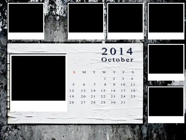 Календарь 2014 с фоторамкой на гранж-стене — стоковое фото
