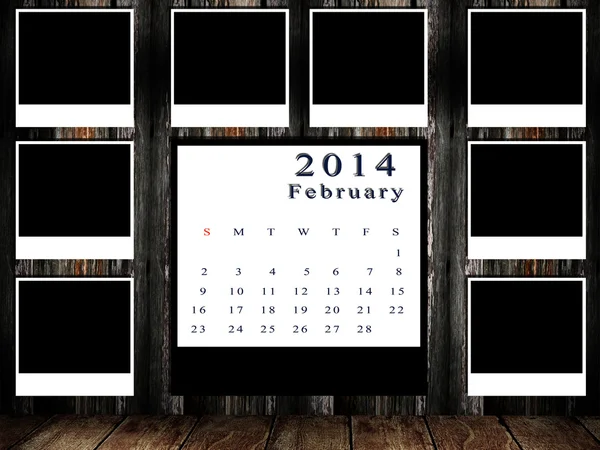 Calendário 2014 conjunto com moldura de foto na parede grunge — Fotografia de Stock