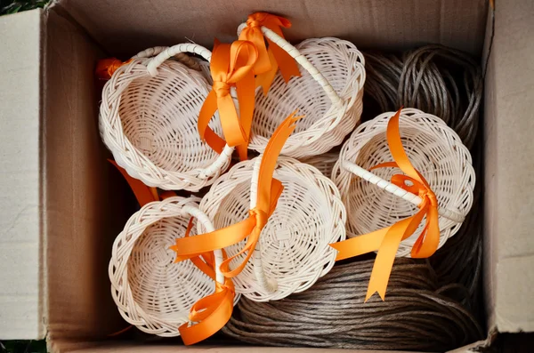 Cute basket with ribbon souvenir in the box — Stock Photo, Image