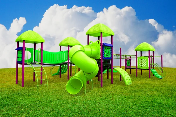 Children's playground in garden with nice sky — Stock Photo, Image
