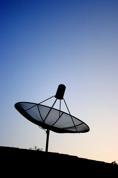 Satellite dish silhouette — Stock Photo, Image