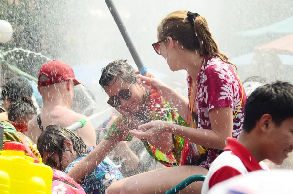 CHIANG MAI, THAILAND - APRIL 15 : People celebrating Songkran water festival in the streets by throwing water at each other on 15 April 2014 in Chiang Mai, Thailand — Stock Photo, Image