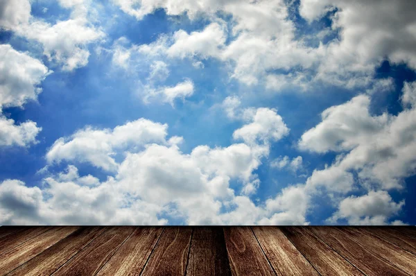 Wooden deck with cloudy sky — Stock Photo, Image