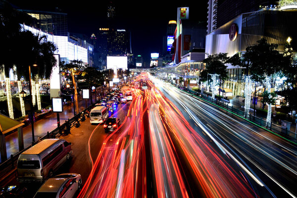 BANGKOK, THAILAND - 22 DEC : Night traffic with long exposure at Rajdamri road on 22 December 2019 in Bangkok, Thailand