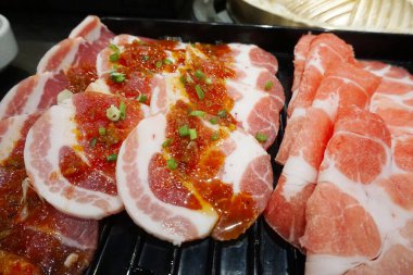 Raw meat for BBQ in black tray, Fresh food for grill