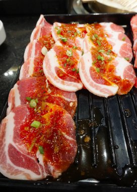 Raw meat for BBQ in black tray, Fresh food for grill