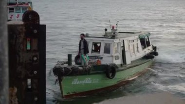 CHONBURI, THAILAND - 8 JULY : Ferry boat send passenger at port on 8 July 2022 in Siracha, Chonburi, Thailand 