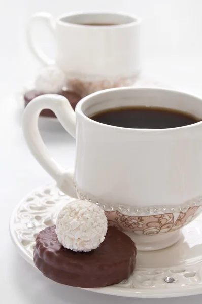 Tasse Kaffee und Bonbons — Stockfoto