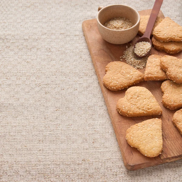Cookies with sesame seeds in the shape of heart — Stock Photo, Image