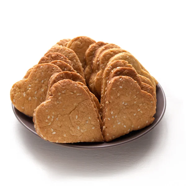 Cookies with sesame seeds in the shape of heart — Stock Photo, Image